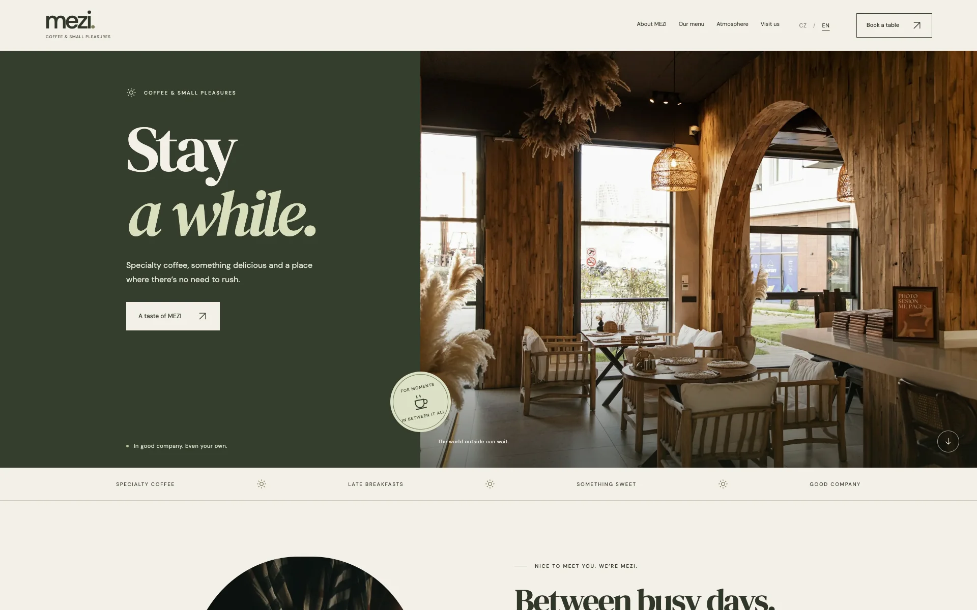 The MEZI café concept homepage with olive typography and interior photography.